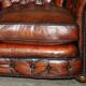 Curved Chesterfield canapé in hand-dyed vintage leather, fully restored.