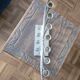 Large modern chrome metal candlestick for Hanukkah.