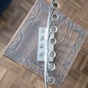 Large modern chrome metal candlestick for Hanukkah.