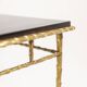 Maison Baguès. Table basse en bronze, laque noire, décor or. Circa 1970