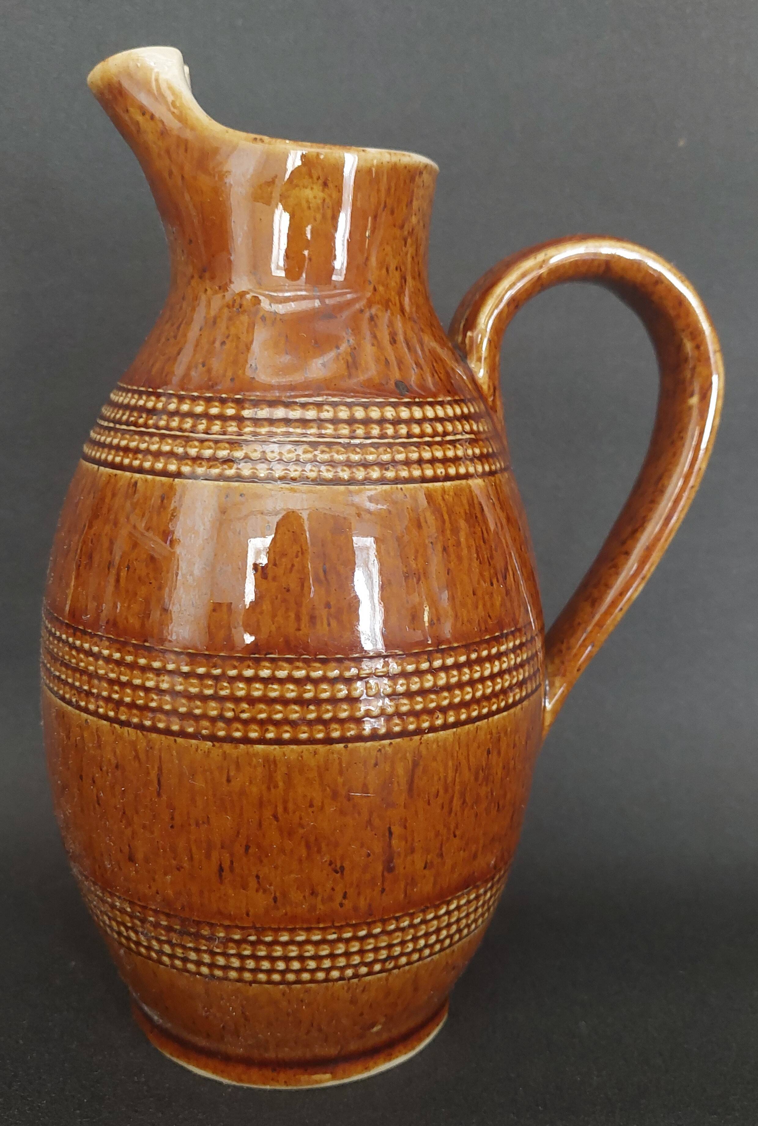 Mid-20th century brown glazed stoneware wine pitcher