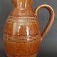Mid-20th century brown glazed stoneware wine pitcher