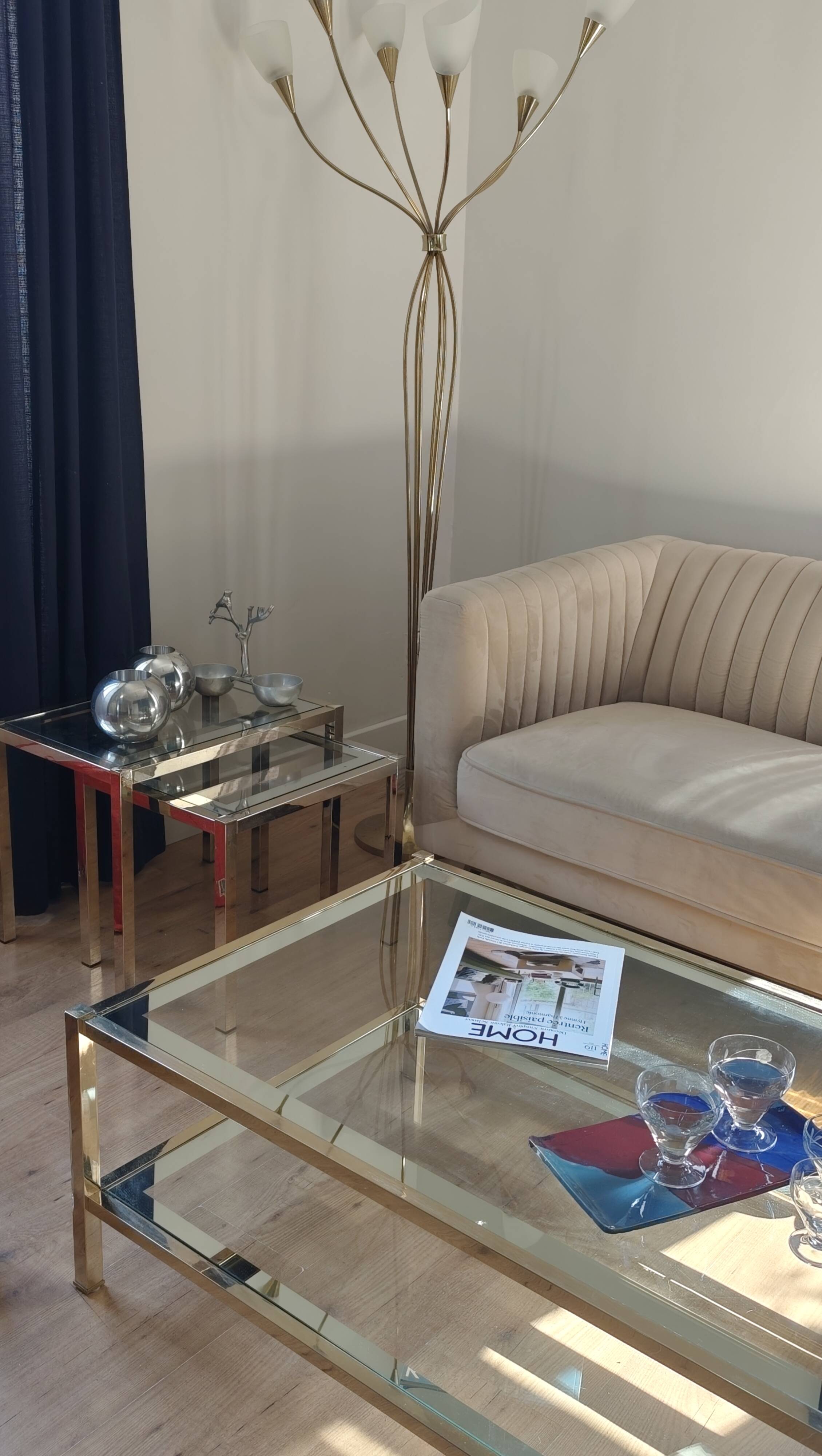 Vintage coffee table with glass, mirror, and brass.