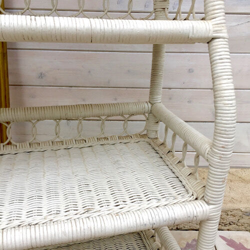 Old shelf in white rattan Peacock
