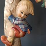 Goebel design Hummel ceramic lamp base with child on an apple tree, 1960s
