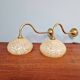 Pair of brass and yellow/white speckled glass wall sconces