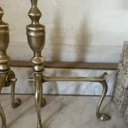 Pair of Victorian brass fire dogs from the late 19th century.