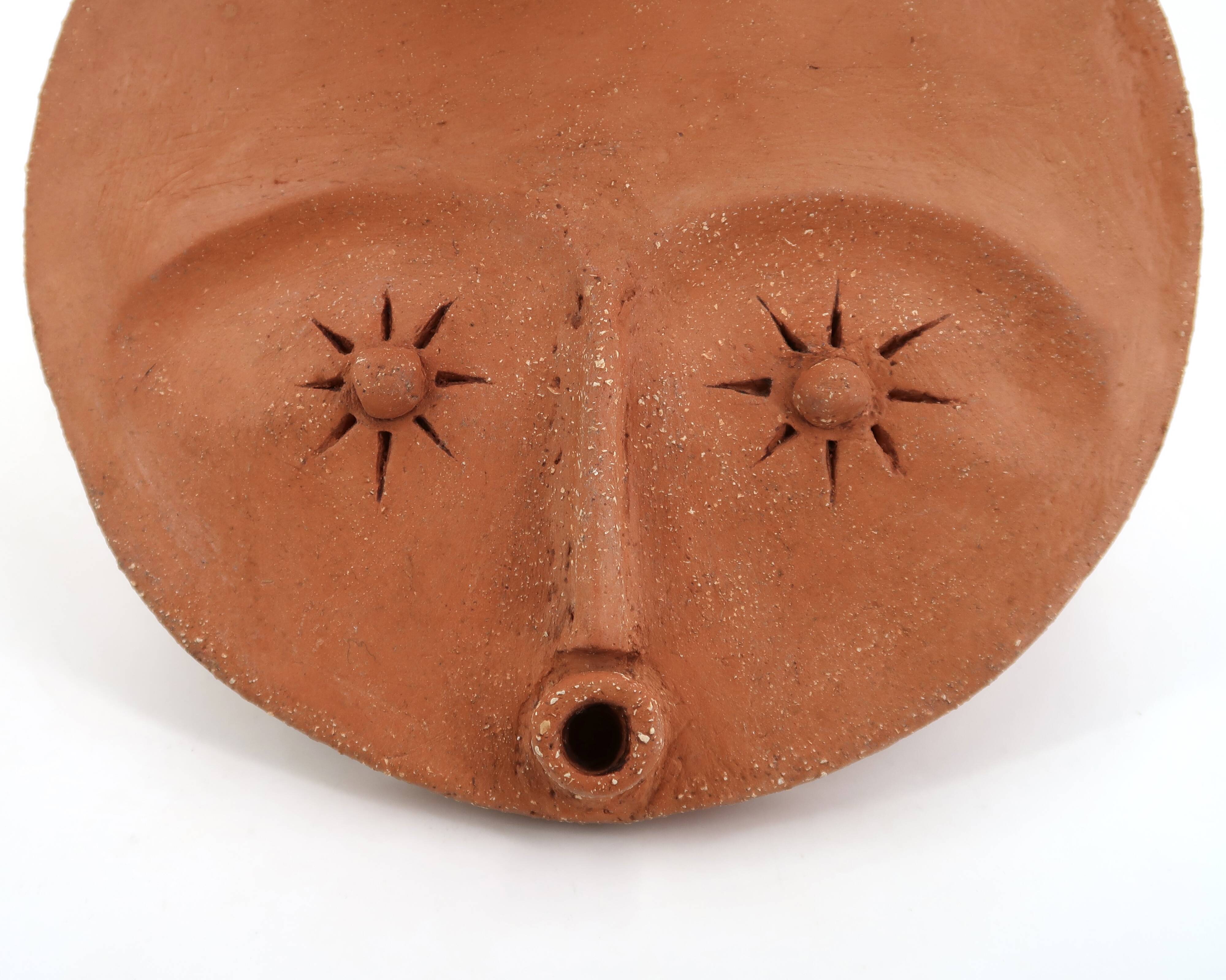 Round ceramic wall mask inspired by Africa, 1980s.