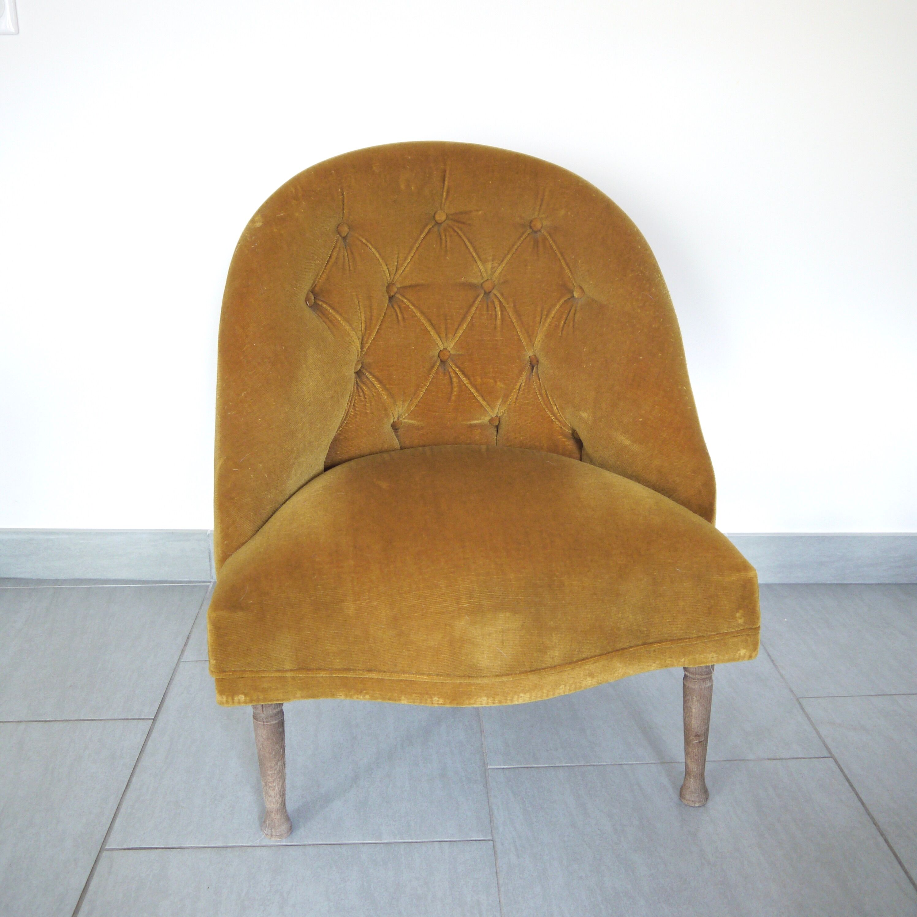 Yellow velvet padded toad armchair