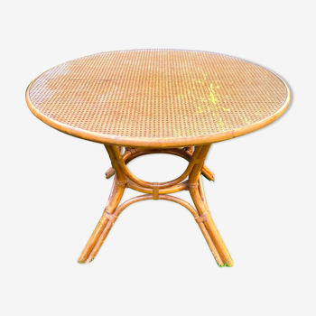 Canned rattan dining table and vintage glass