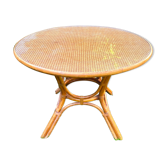 Canned rattan dining table and vintage glass