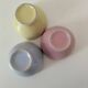 Set of three pastel two-tone mini bowls in glazed ceramic.