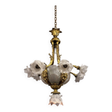 Rare and important gilded bronze chandelier with shells and roses.