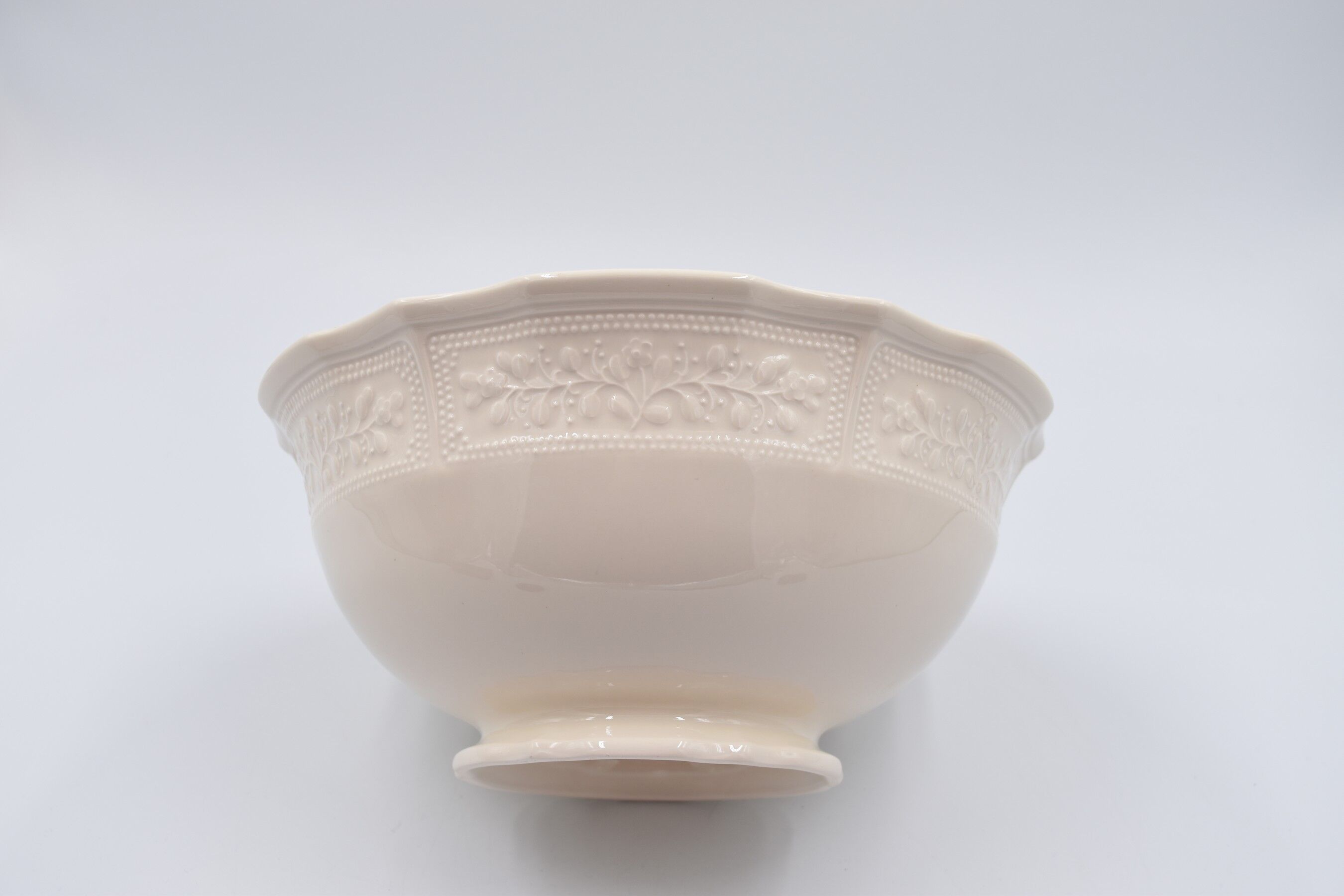 Salad bowl in off-white earthenware ivory Lunéville decoration in relief France