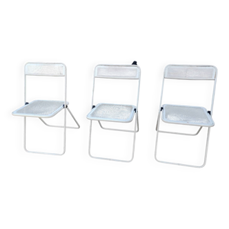 Set of three folding chairs with perforated metal.
