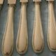 Set of 12 cheese or fruit knives with silver metal handles.