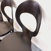 Set of 4 vintage Mouette chairs by Baumann in black wood from the 1960s.