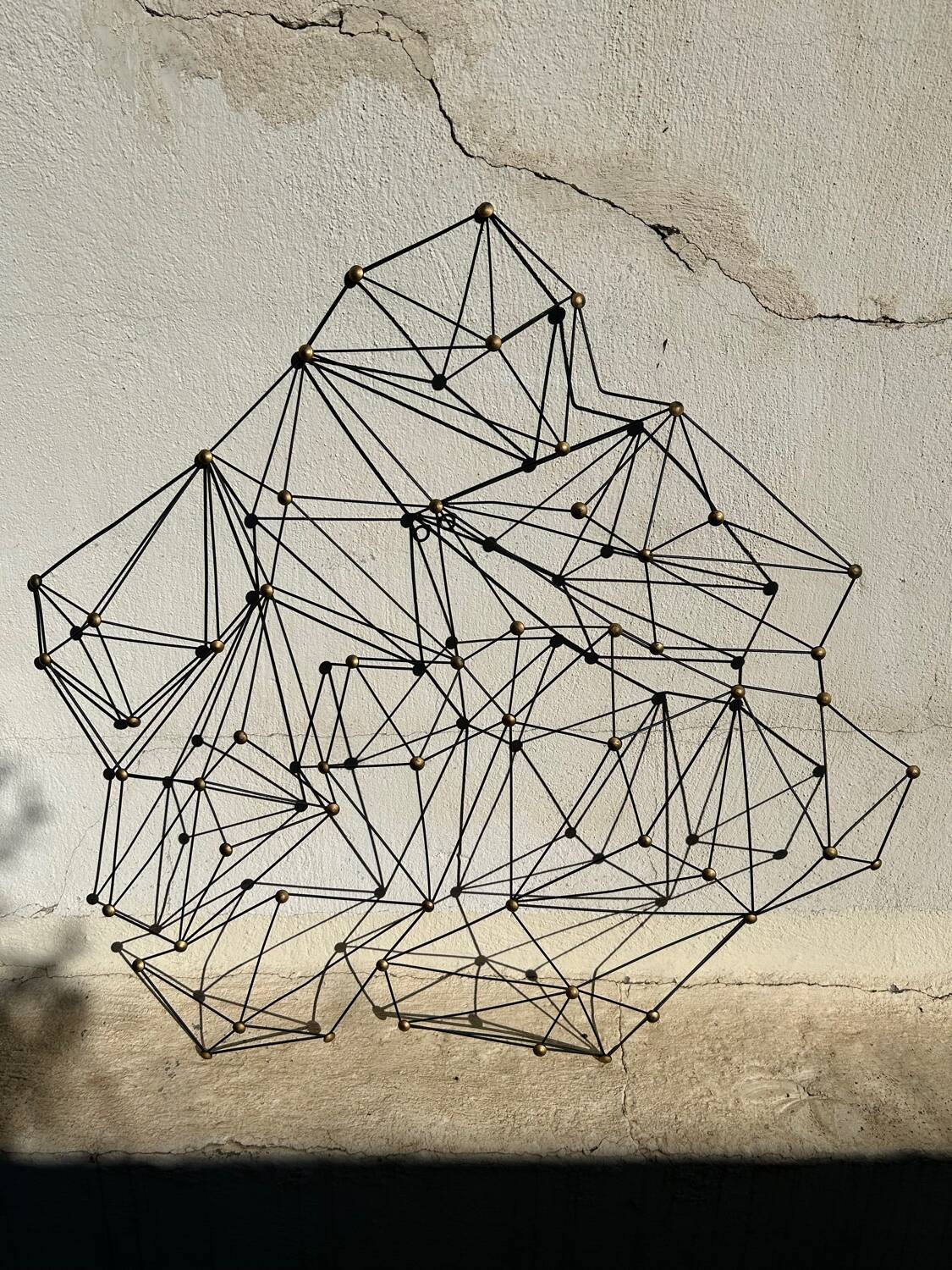 Vintage black metal wall sculpture