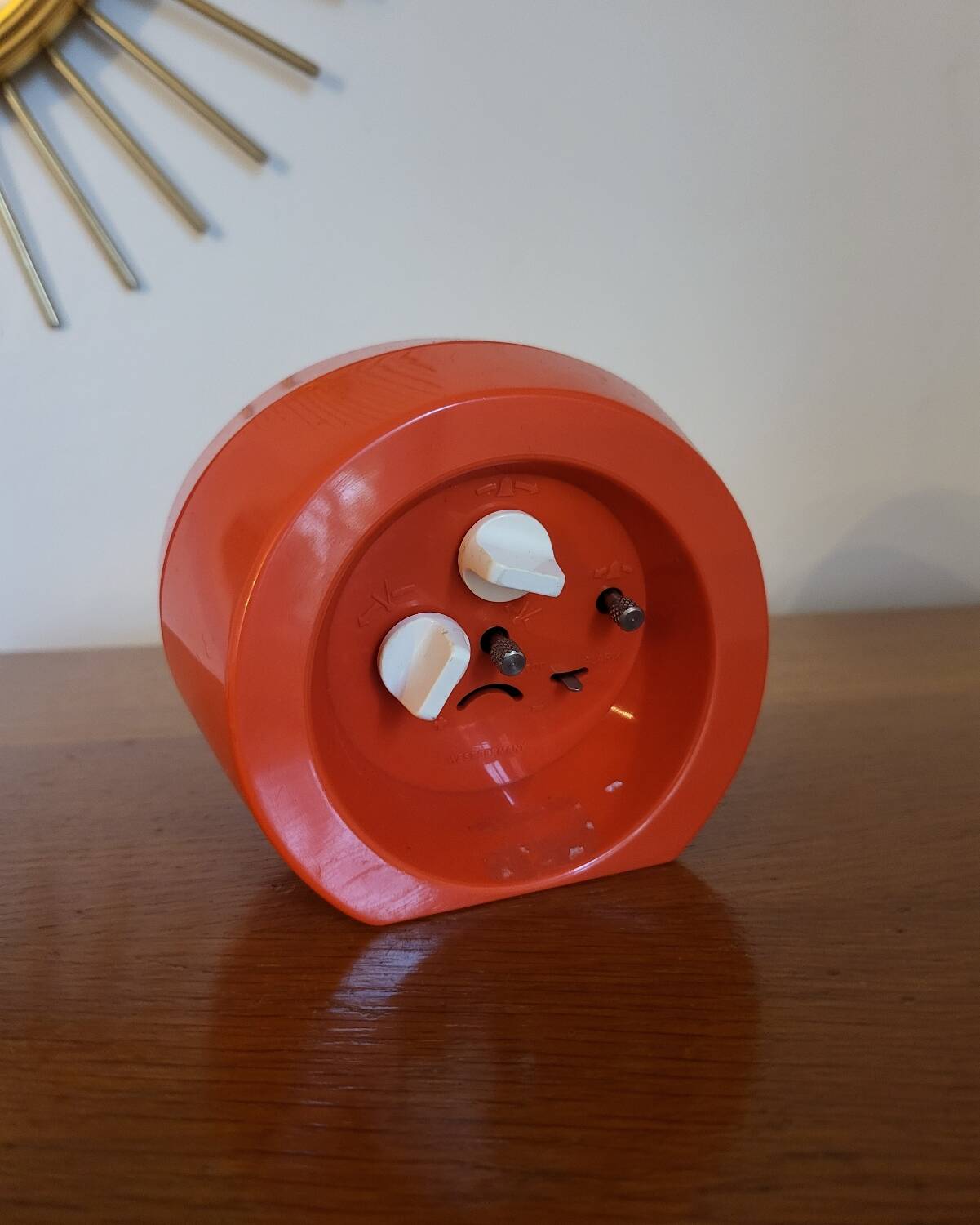 Vintage mechanical alarm clock in orange plastic Uti West Germany