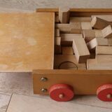 Old raw wood construction game in its cart