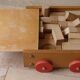 Old raw wood construction game in its cart