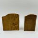 Wall-mounted egg cup holder and wooden utensil holder.