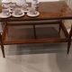Coffee table / side table in mahogany with a rattan shelf.