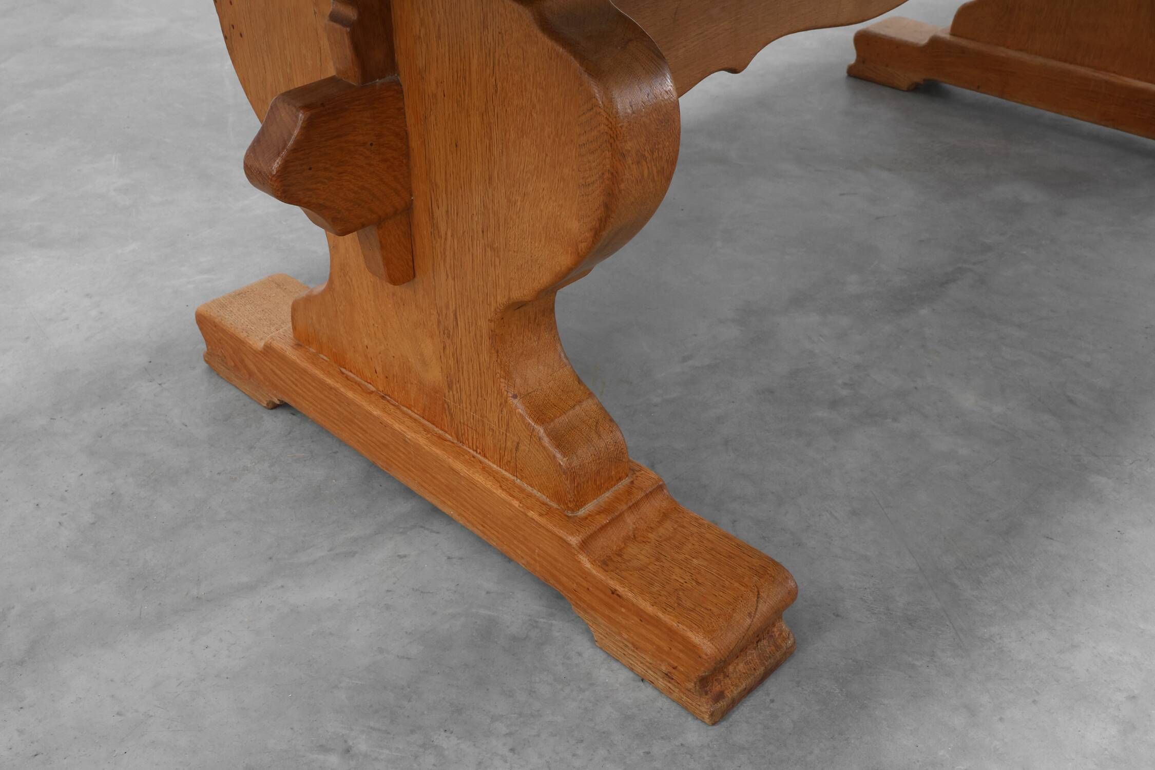 20th Century French oak trestle table with scalloped legs and plank top