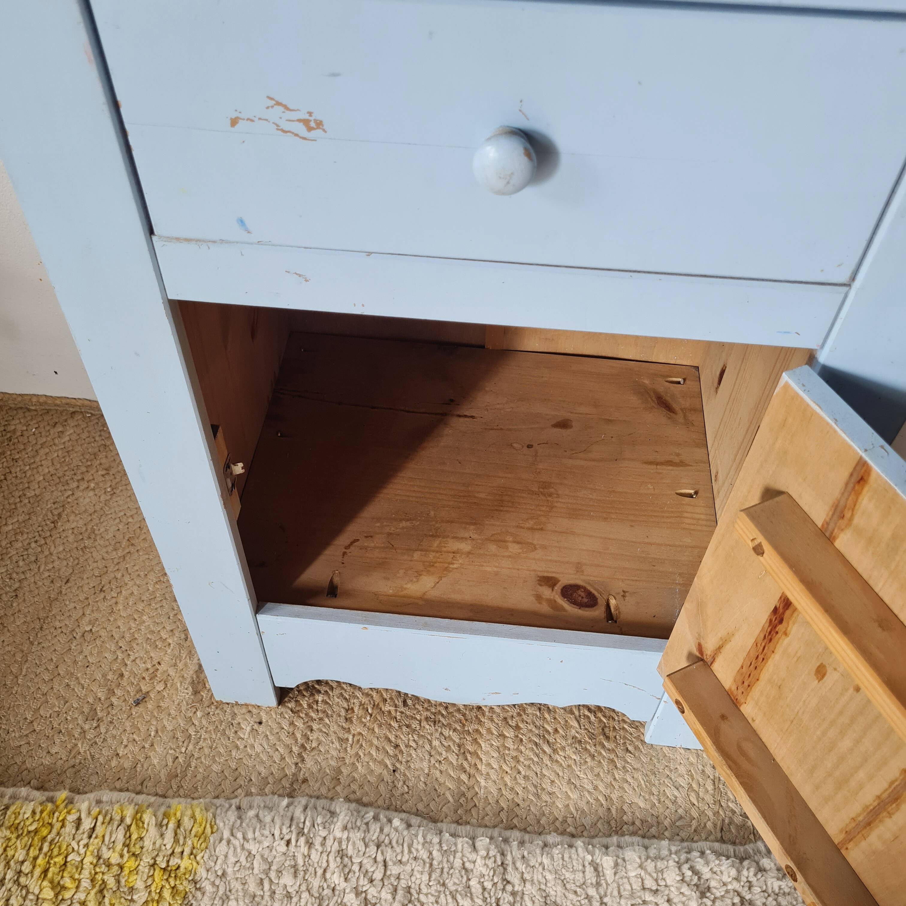 Handcrafted blue chest of drawers.