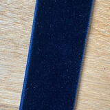 Vintage witch's eye curved mirror hangs velvet ribbon