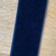 Vintage witch's eye curved mirror hangs velvet ribbon