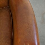 Beautiful and comfortable sheepskin armchair, finished with decorative nailheads