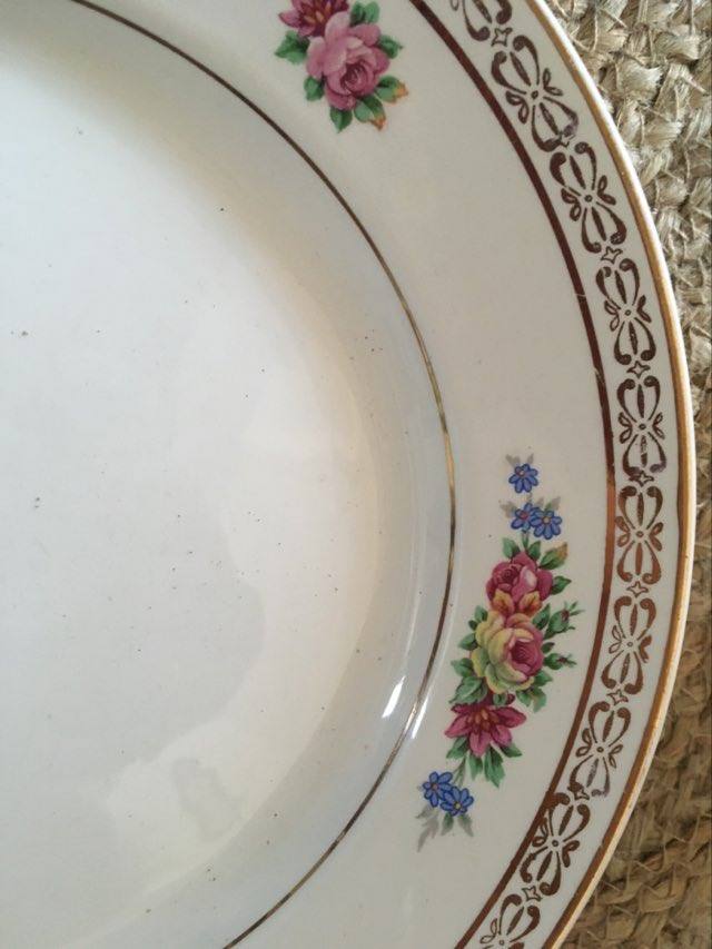 Old plates with matching flowers