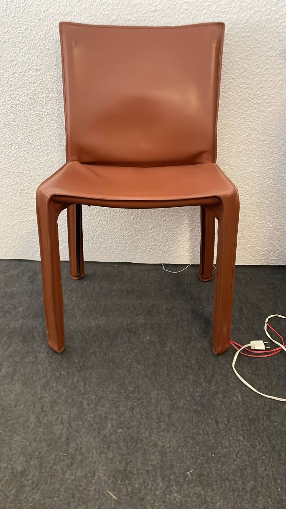 Brown leather zipped chair in Bellini style, Italian design.