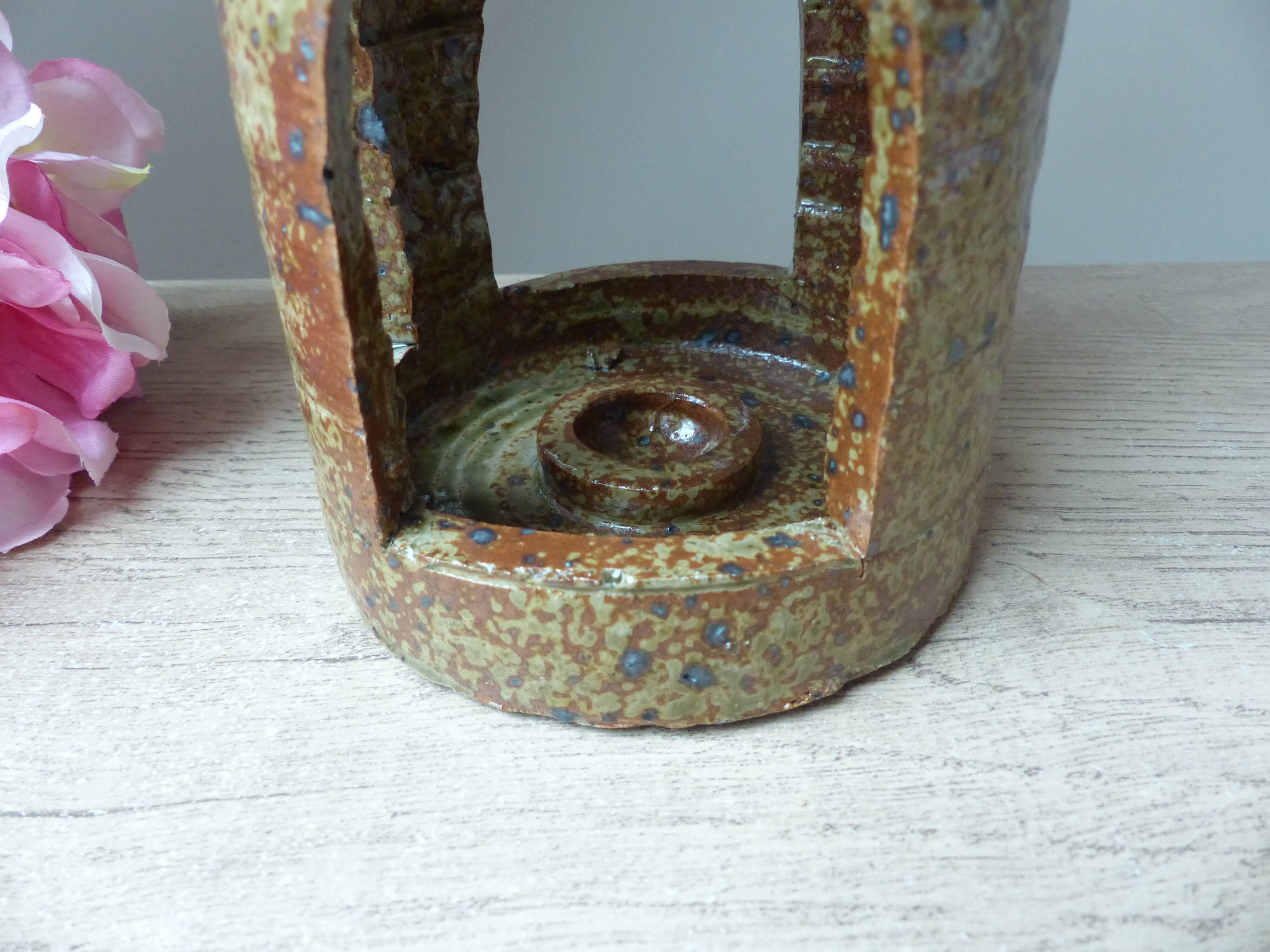 Old candle holder lantern in pyrite sandstone, decorative lantern