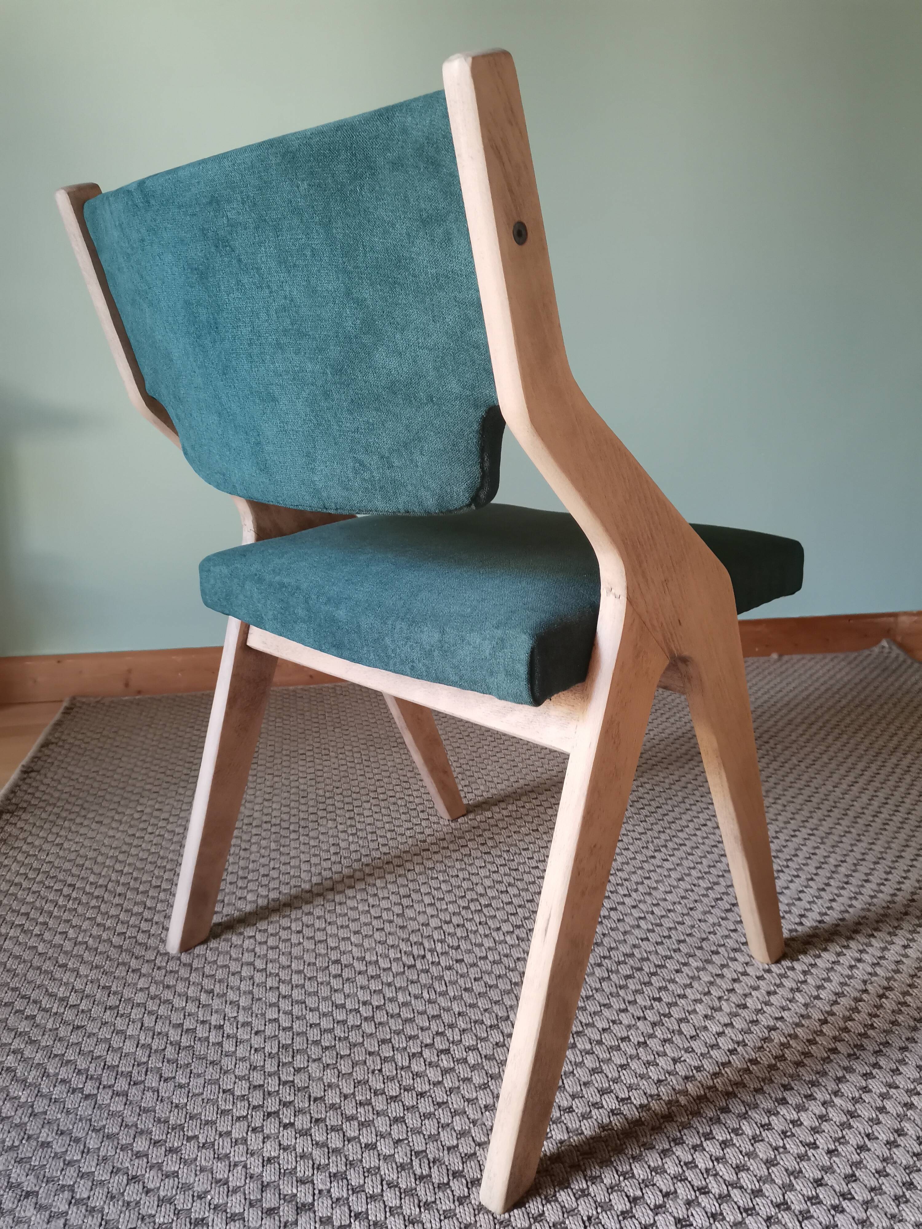 Scandinavian green chairs with tapered legs.