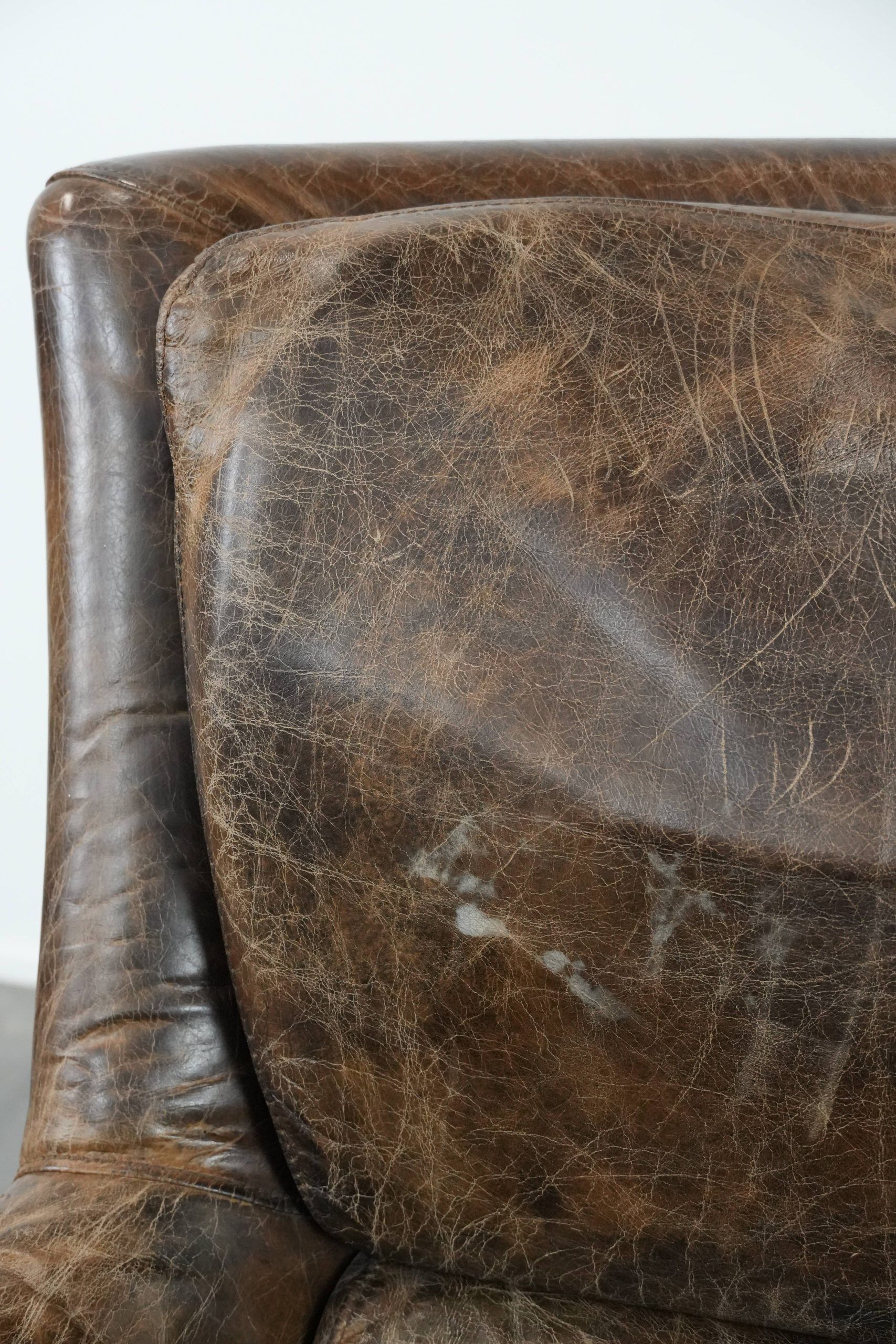 Very comfortable vintage cow leather armchair with character