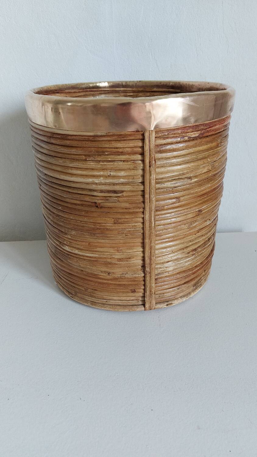 Rattan and brass pot cover