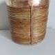 Rattan and brass pot cover