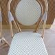 Pair of Parisian bistro chairs from Maison Louis Drucker in light Manila rattan.