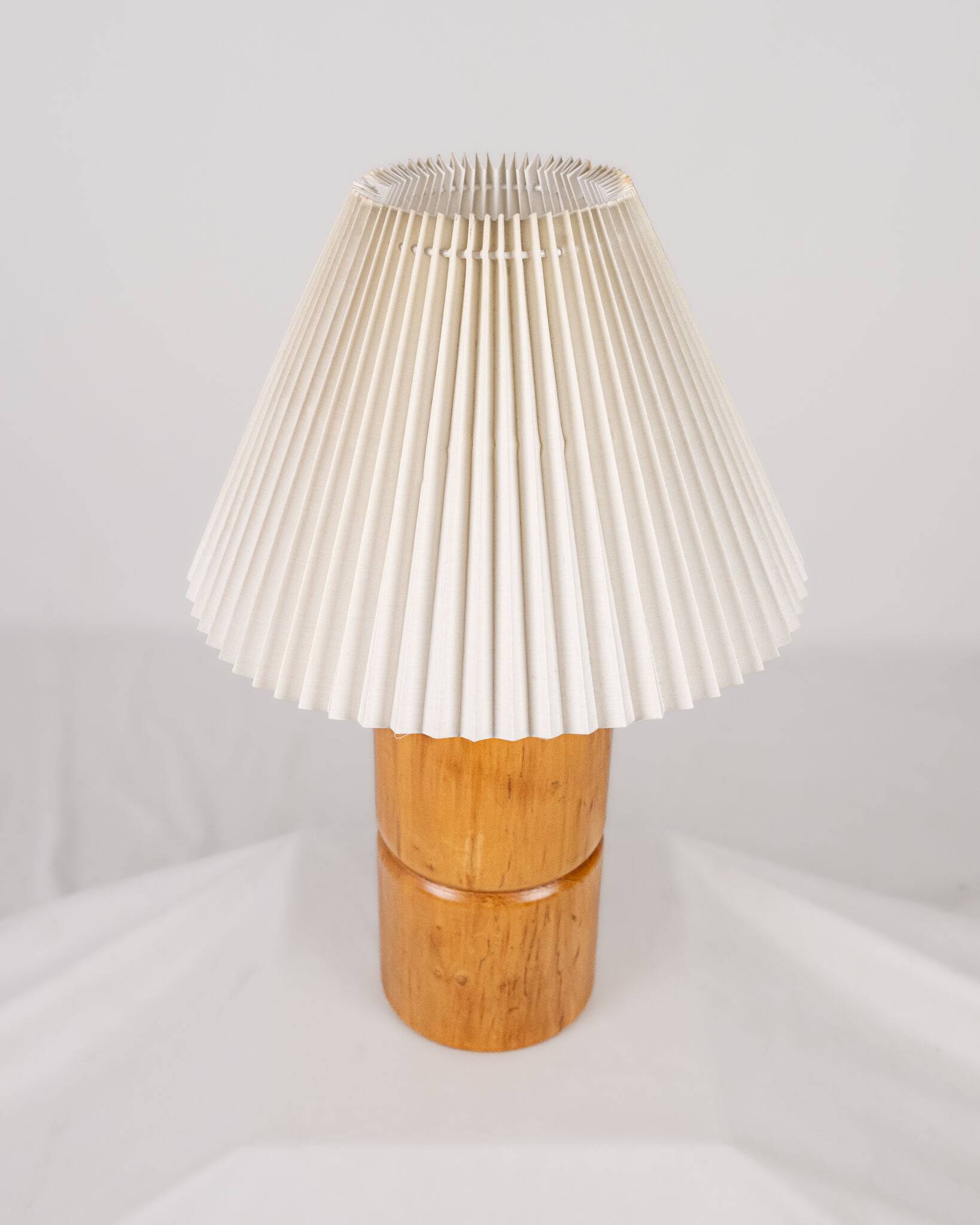 Cylindrical table lamp made of solid turned wood, France, 1970.
