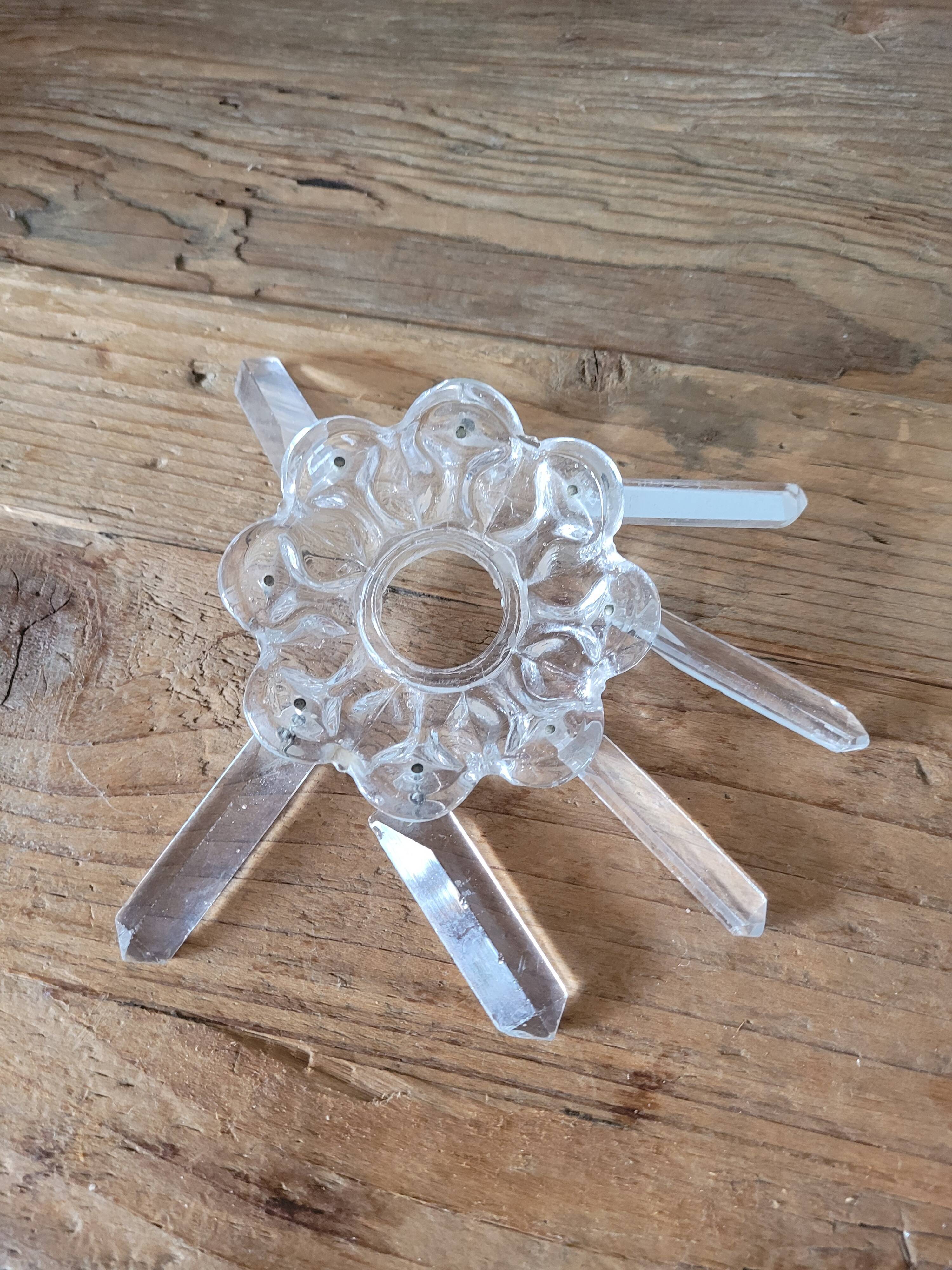 Old candlestick with molded glass stamps