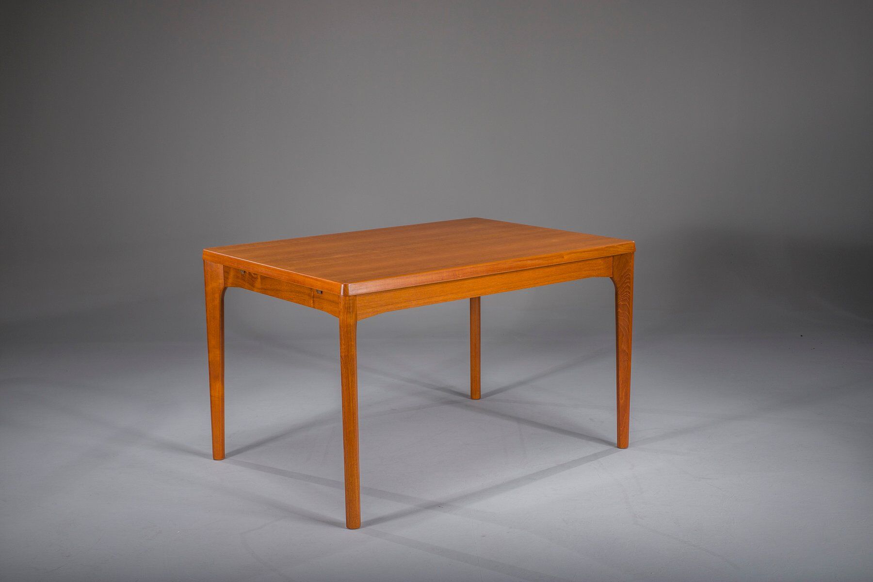 Extendable teak dining table by Henning Kjaernulf for Vejle Stole & Møbelfabrik
