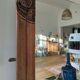 Art Deco wooden furniture with a swivelling mirror and marble top.