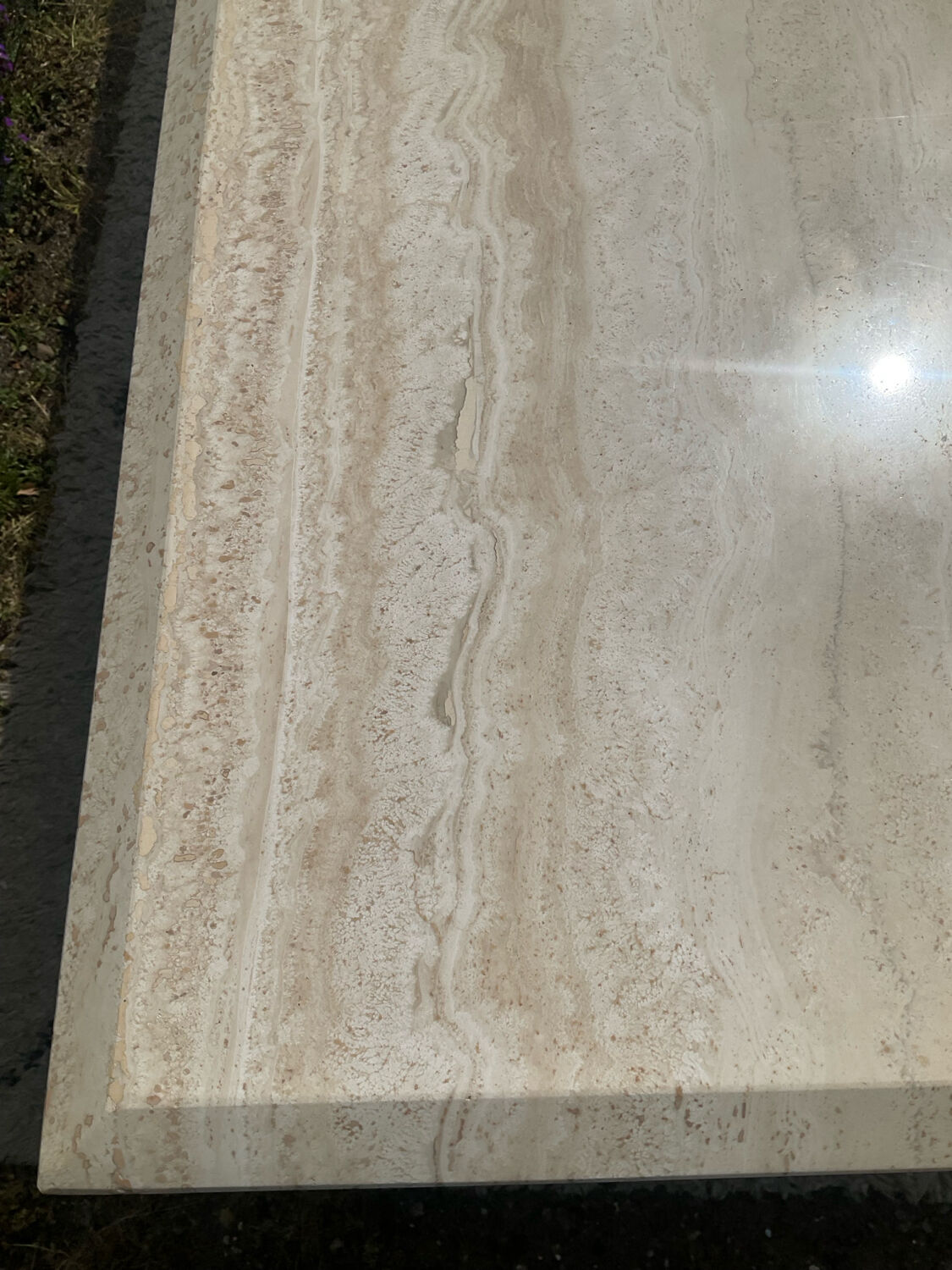 Large vintage dining table in travertine in the 1970s Carpa style.