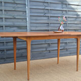 Single extension dining table by McIntosh
