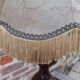 Vintage wooden lamp with fringed shade