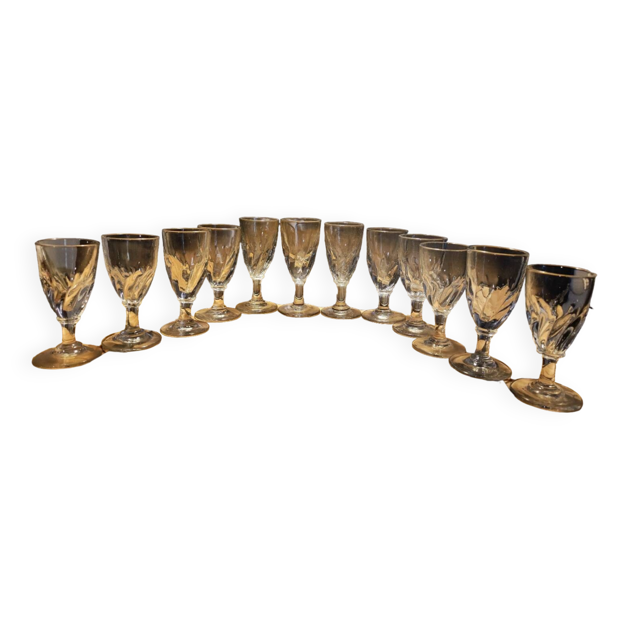 12 small twisted bistro glasses, 19th century