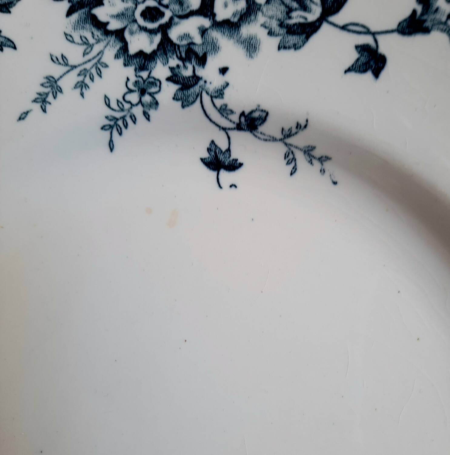 Old mismatched dinner plates accompanied by a dish