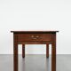 Antique French farmhouse table with two drawers and an extendable leaf.